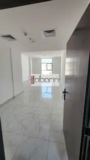 For rent in Ajman, Al Yasmeen area: a very spacious one-bedroom apartment with a living room—first