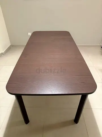 Solid wood rectangular dining table (~1.8M). Dark brown, good condition