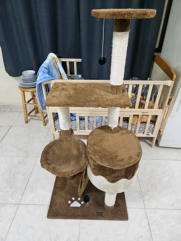 Used multi-level brown cat tree with scratching posts and perches