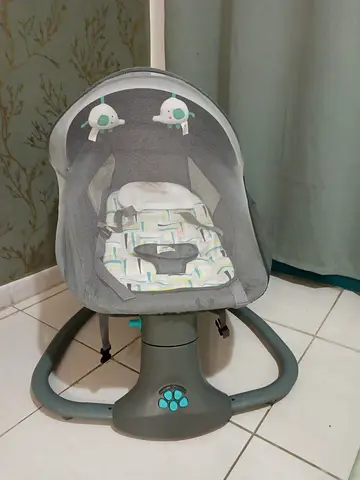 Gray baby rocking bouncer with canopy and toys - good condition