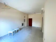 For annual rent in Al Rashidiya 2 Ajman a two-bedroom apartment with a living room two bathrooms a b
