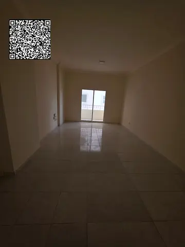 Available for annual rent in Ajman (Al Rashidiya 3, on the main Al Muroor Street): A spacious unit featuring a bedroom, a living room, two bathrooms,