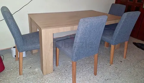 Wooden dining table with 4 upholstered grey chairs - good condition
