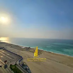 With a sea view. Luxury apartment, first occupancy, two bedrooms, living room, and balcony. Ajman Co