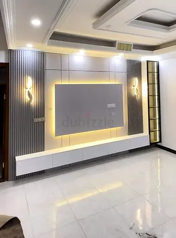 Modern TV Wall Unit with Built-in LED Lighting and Shelves