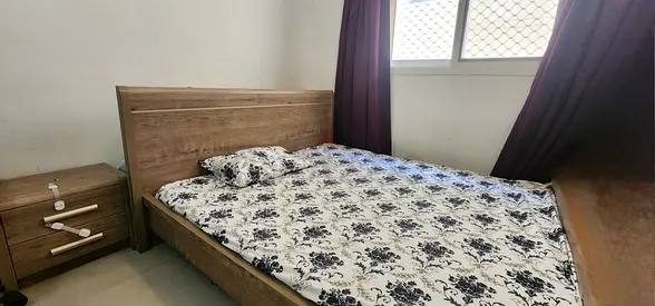King size bed with mattress and side table