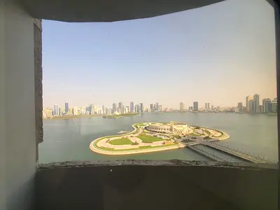 Two bedrooms and a living room with a view of Al Majaz Amphitheatre 3; includes 2 bathrooms, a laundry room, 2 balcony >parking >deposite 5%.