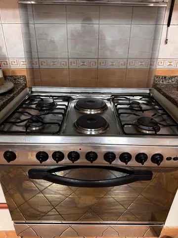 Used stainless steel freestanding gas cooker with electric plates and gas oven