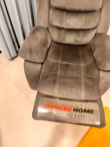Grey single reclining lounge chair in good condition