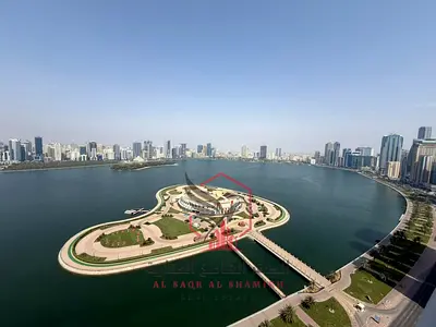 Full sea view overlooking Al Majaz Amphitheatre – a spacious three-bedroom apartment with a living room, balcony, parking, swimming pool, and free gym