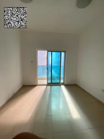One-bedroom apartment with a living room available for annual rent at City Tower, Al Nuaimiya. Features include a master bedroom, a balcony, and two b
