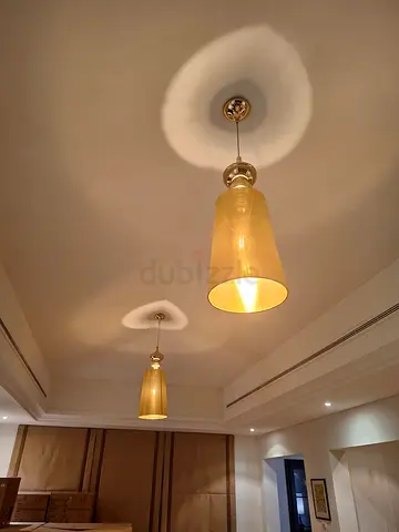 Pair of modern ceiling pendant lights - brass finish, warm shades