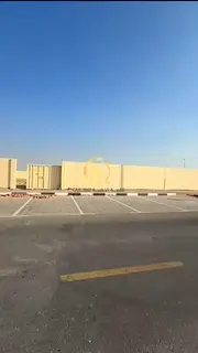 Warehouse for rent in the Al-Sajja Industrial Area, Oasis District, corner on two streets. Area: 20,
