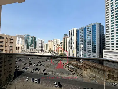 2BR apartment with living room in Al Majaz 2, balcony & free parking. Prime location near cafés, shops, all services, and easy access to Dubai exit.