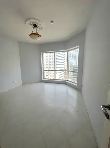 Apartment for Annual Rent – Al Qasba (Al Majaz 3) One-bedroom apartment with a living room, featuri