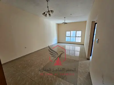 Cheapest one-bedroom apartment with a spacious living room, large balcony, open view, and flexible payment options for rent in Al Majaz 3.