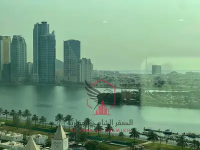 Apartment for annual rent - Al Majaz 1. Air conditioning, gym, swimming pool, free parking, spacious areas, open sea view, free maintenance,