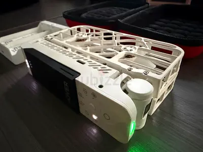Foldable White Consumer Drone with Protective Cage and Case