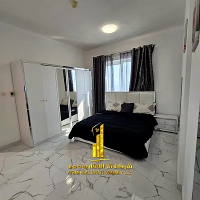 Two-bedroom apartment with a living room in Ajman - Al Rashidiya 1 - Oasis Towers - furnished with new furniture for monthly rent