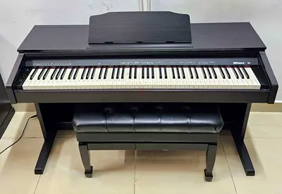 The Roland RP30 is a budget-friendly 88-key digital console piano designed for beginners and student