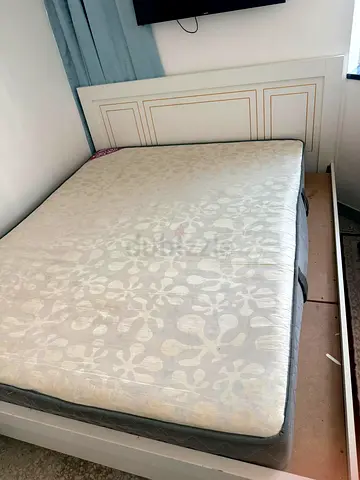 White wooden bed frame with mattress included - Queen size I’m selling a white IKEA wardrobe with ma