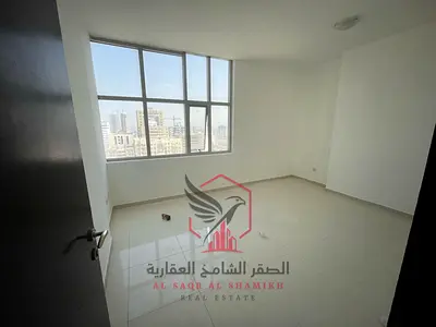 Cheapest two-bedroom apartment with a hallway and balcony, open view, free gym and pool, excellent finishing, easy access to Dubai, for rent in Al Qas