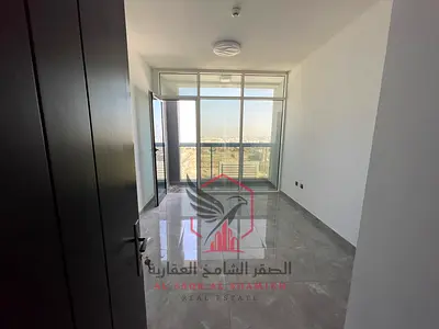 Beautiful two-bedroom apartment with a panoramic view, free parking, free gym and swimming pool, master bedroom, first exit to Dubai, for rent in Al M