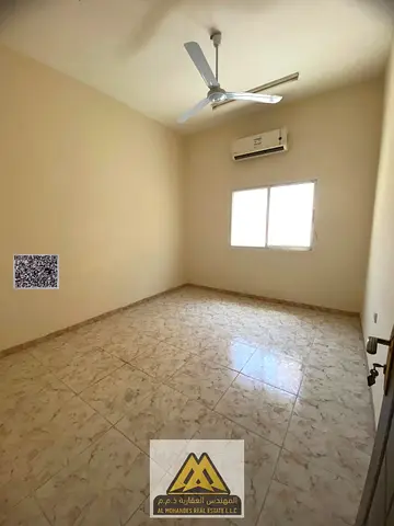 Annual Rent: Spacious studio in Al Rawda 3, separate kitchen, split AC, near Sheikh Ammar Road, AED 17,997, payable in 4 cheques. Suitable for singles