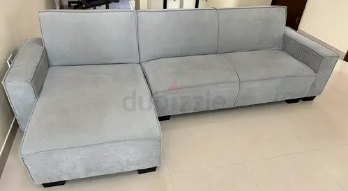 Light grey L-shaped fabric sofa with chaise - good condition