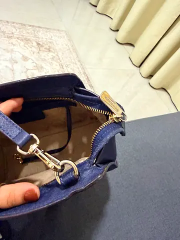 Branded original women's shoulder bag with gold hardware - good condition