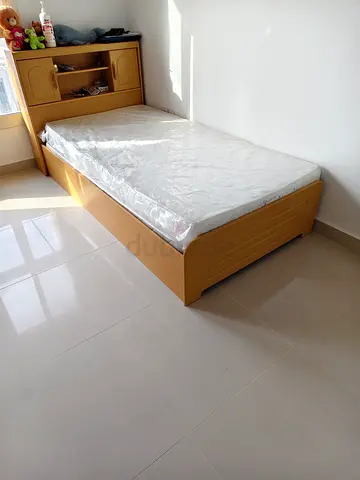 Single wooden bed with headboard storage and mattress - good condition