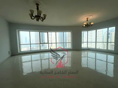 Free AC & parking + gym, pool & garden | 2BR + living room, panoramic view, built-in wardrobes | Near Dubai exit.