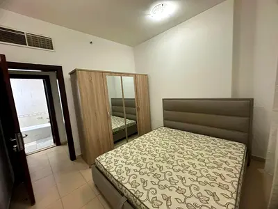Two-bedroom apartment with a living room for annual rent in City Towers - Al Nuaimiya, with a large