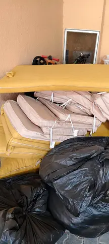 Set of used outdoor/indoor chair cushions - beige and mustard (stack of cushions)