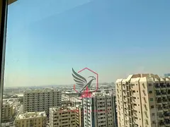 Two-bedroom apartment with living room in Al Majaz 2, free AC, open view, balcony, prime lively loca