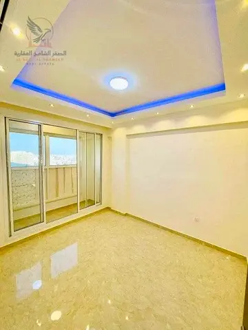 For annual rent in Ajman a three-bedroom apartment with a living room in Al Rawda featuring a spacious layout elegant design and a prime location clo