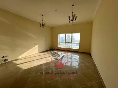 2BR apartment for rent in Al Majaz 1, free AC, free parking, with a stunning sea view.
