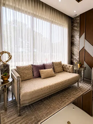 Elegant upholstered sofa/chaise with decorative cushions