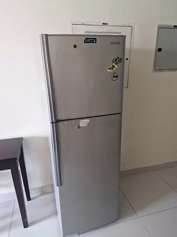 Silver two-door refrigerator in good working condition