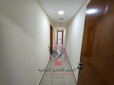 Apartment for annual rent - Al Majaz 3. Features include: air conditioning, gym, swimming pool, free parking, maid's room, spacious areas, 2 balconies