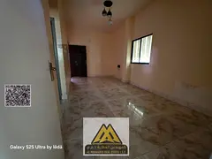 Annual Rent: Spacious ground-floor studio in Al Rashidiya 1, separate kitchen, balcony, free parking
