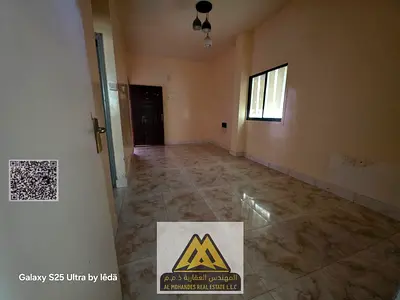 Annual Rent: Spacious ground-floor studio in Al Rashidiya 1, separate kitchen, balcony, free parkin