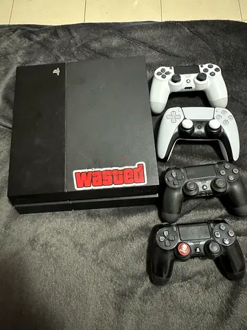 Ps4with controllers and games and cooler with holder