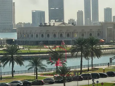 Sea view two-bedroom apartment with a kitchen balcony in the finest towers of Sharjah, offering all services, modern finishing, and spacious layouts.