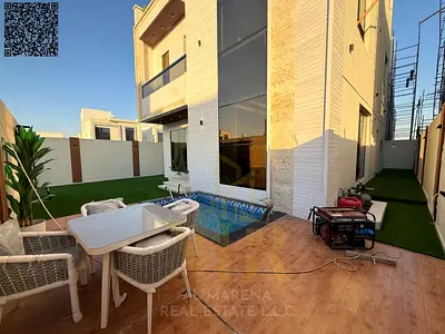 Stunning villa in Al Zahia, | 5 bedrooms | Private pool | Elegant poolside seating area | Price includes fees