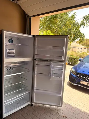 Used double-door refrigerator with top freezer — good condition