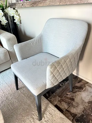 Light grey upholstered dining/side chair with quilted seat — set of 2 available