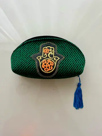 Small green embroidered zip pouch with tassel - used