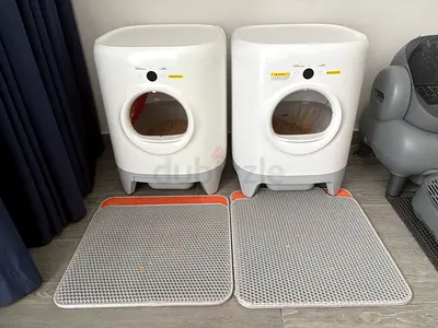 Pair of automatic cat litter boxes with mats - lightly used