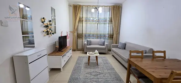 Furnished 1BR apartment in City Tower, Khalifa Street opposite Grand Mall, clean furniture, 2 bathrooms, balcony, bills, internet and private parking